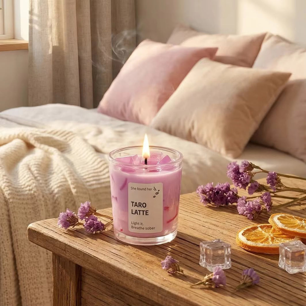 Taro Latte soy candle burning on a bedside table