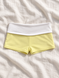 Butter foldover swim shorts flat lay