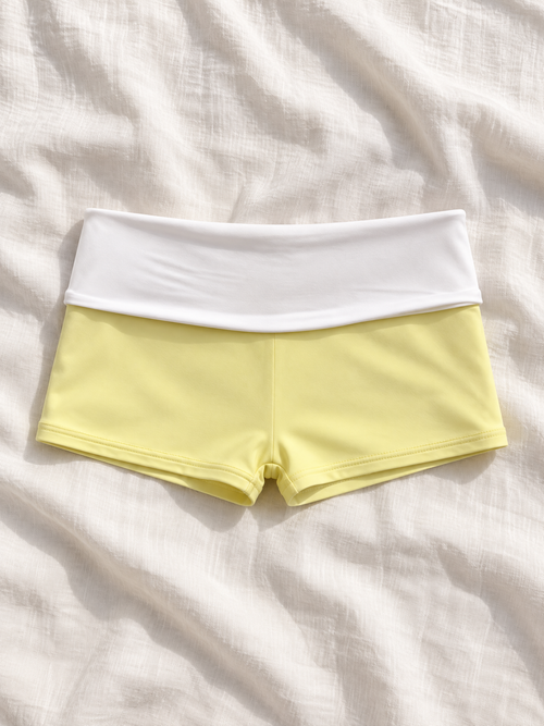 Butter foldover swim shorts flat lay