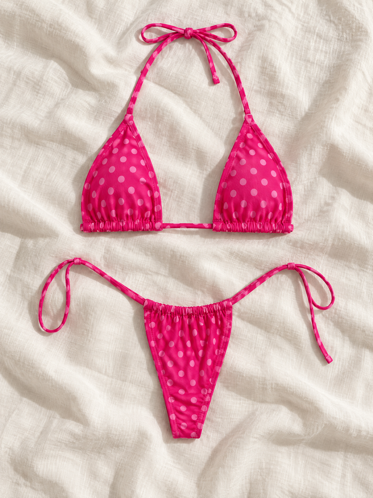 Hot pink dot tie bikini flat lay