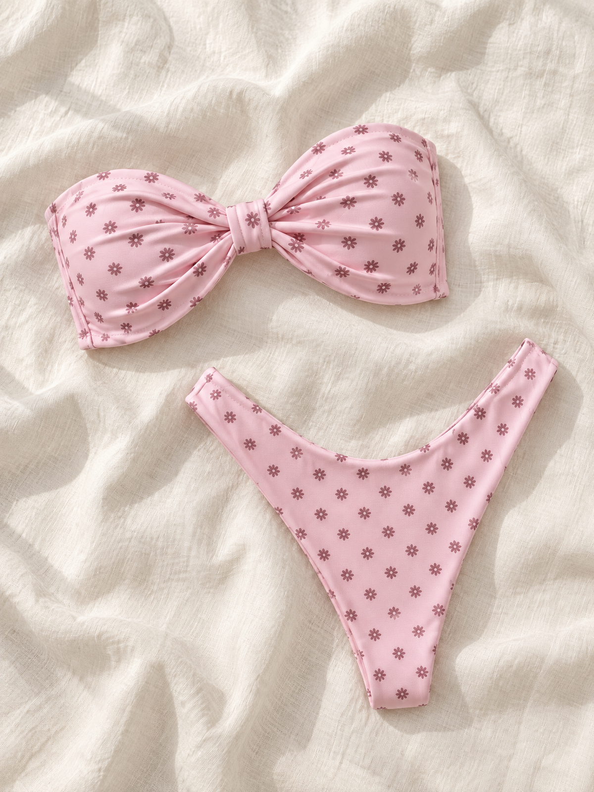 Pink daisy bandeau bikini flat lay
