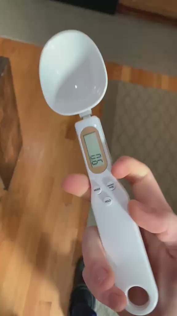 Digital scale spoon weighing in use
