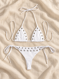 White eyelet tie bikini flat lay